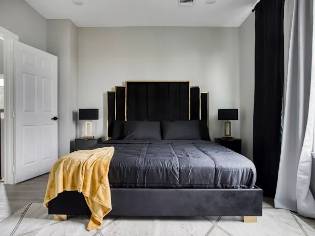 a bedroom with a bed and a walk in closet