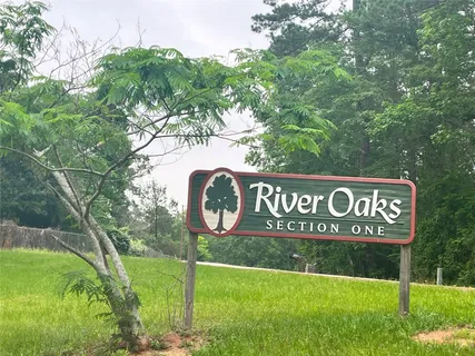 a view of outdoor space with sign board and garden