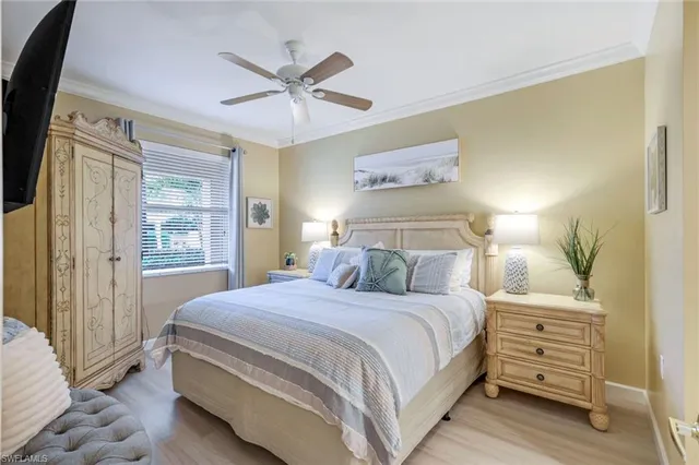 a kitchen with stainless steel appliances granite countertop a dining table chairs refrigerator and sink