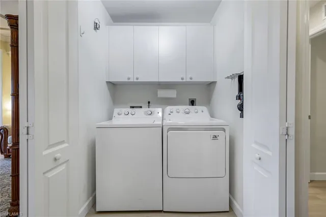 a bathroom with a toilet a sink a mirror and vanity