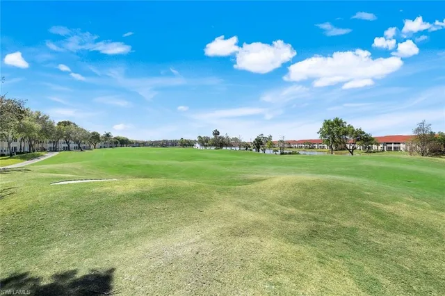 a view of an outdoor dining space with a table and chairs