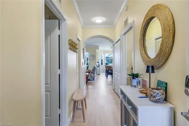 a dining room with furniture and a mirror