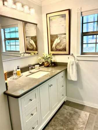 a kitchen with granite countertop a stove and a sink
