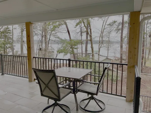 a view of backyard with patio and outdoor seating