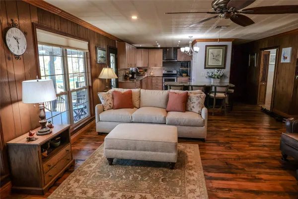a kitchen with stainless steel appliances granite countertop a stove refrigerator sink and cabinets