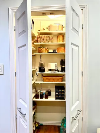 a view of a dining room with furniture and a potted plant