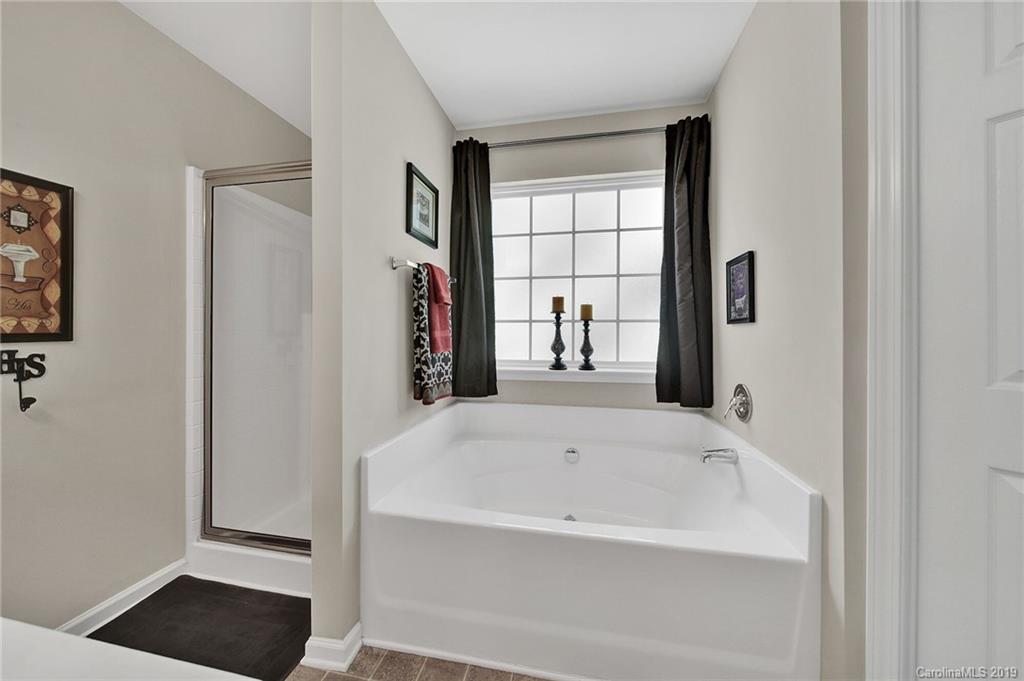 2015 Gunnars Ridge Road, Unit 1/1 Lancaster, SC 29720 - Photo 4 of 19 a white bath tub sitting next to a window