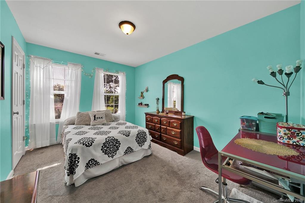 2015 Gunnars Ridge Road, Unit 1/1 Lancaster, SC 29720 - Photo 6 of 19 a bedroom with a bed and a potted plant