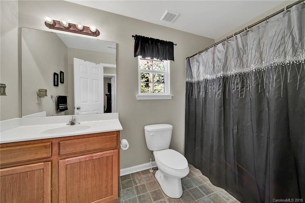 2015 Gunnars Ridge Road, Unit 1/1 Lancaster, SC 29720 - Photo 7 of 19 a view of bathroom with a toilet sink and mirror