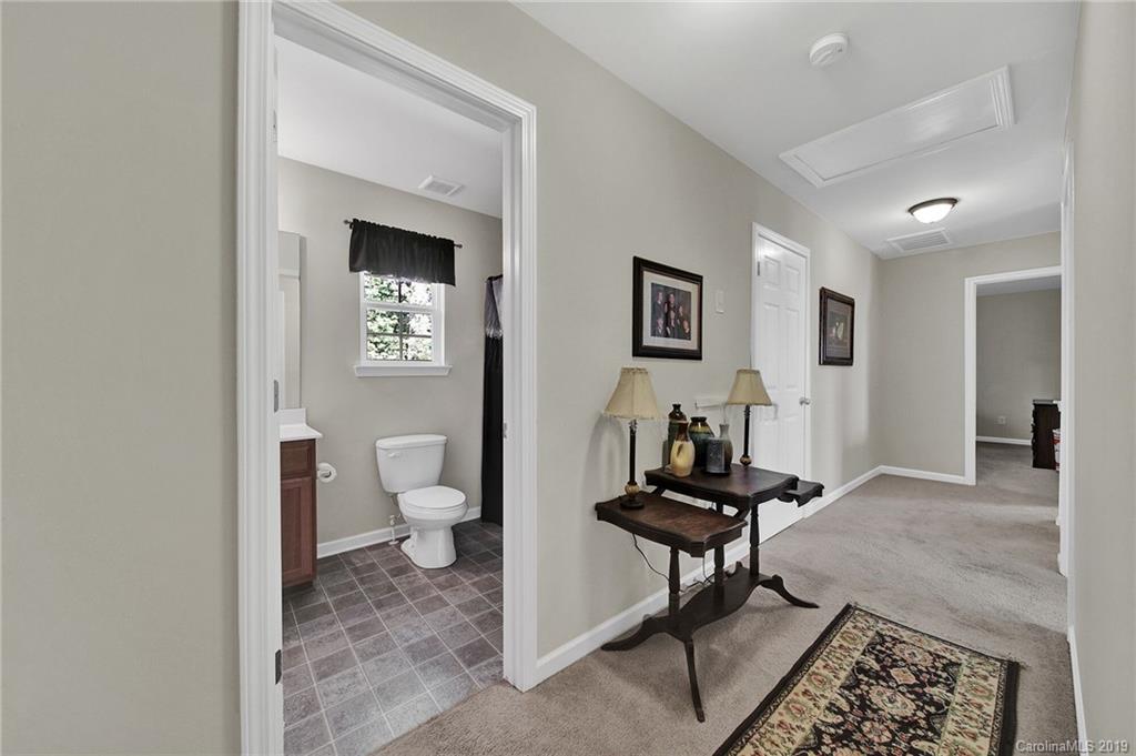 2015 Gunnars Ridge Road, Unit 1/1 Lancaster, SC 29720 - Photo 8 of 19 a living room with furniture and a painting on the wall