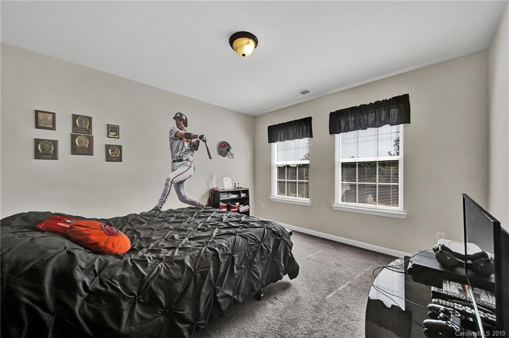 2015 Gunnars Ridge Road, Unit 1/1 Lancaster, SC 29720 - Photo 10 of 19 a bedroom with a bed and a window