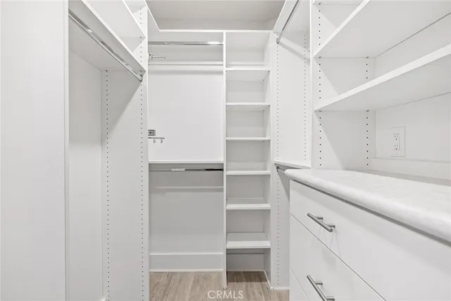 a view of an empty walk in closet