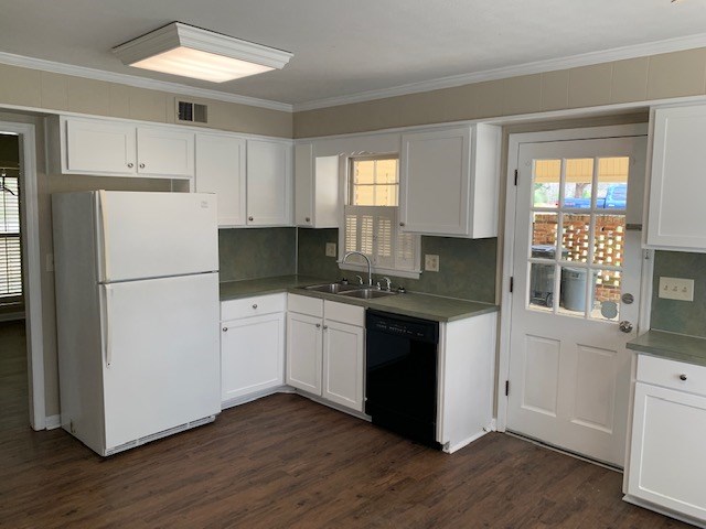 9050 Warm Springs Road Midland, GA 31820 - Photo 8 of 13 a kitchen with granite countertop white cabinets and white appliances