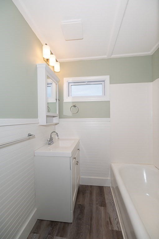 13 Washington Street, Unit 2 Beverly, MA 01915 - Photo 11 of 14 a bathroom with a sink a toilet and vanity