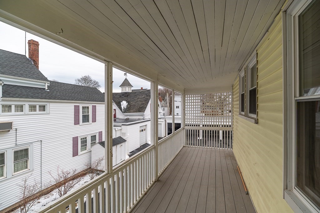 13 Washington Street, Unit 2 Beverly, MA 01915 - Photo 13 of 14 a view of a balcony with wooden floor