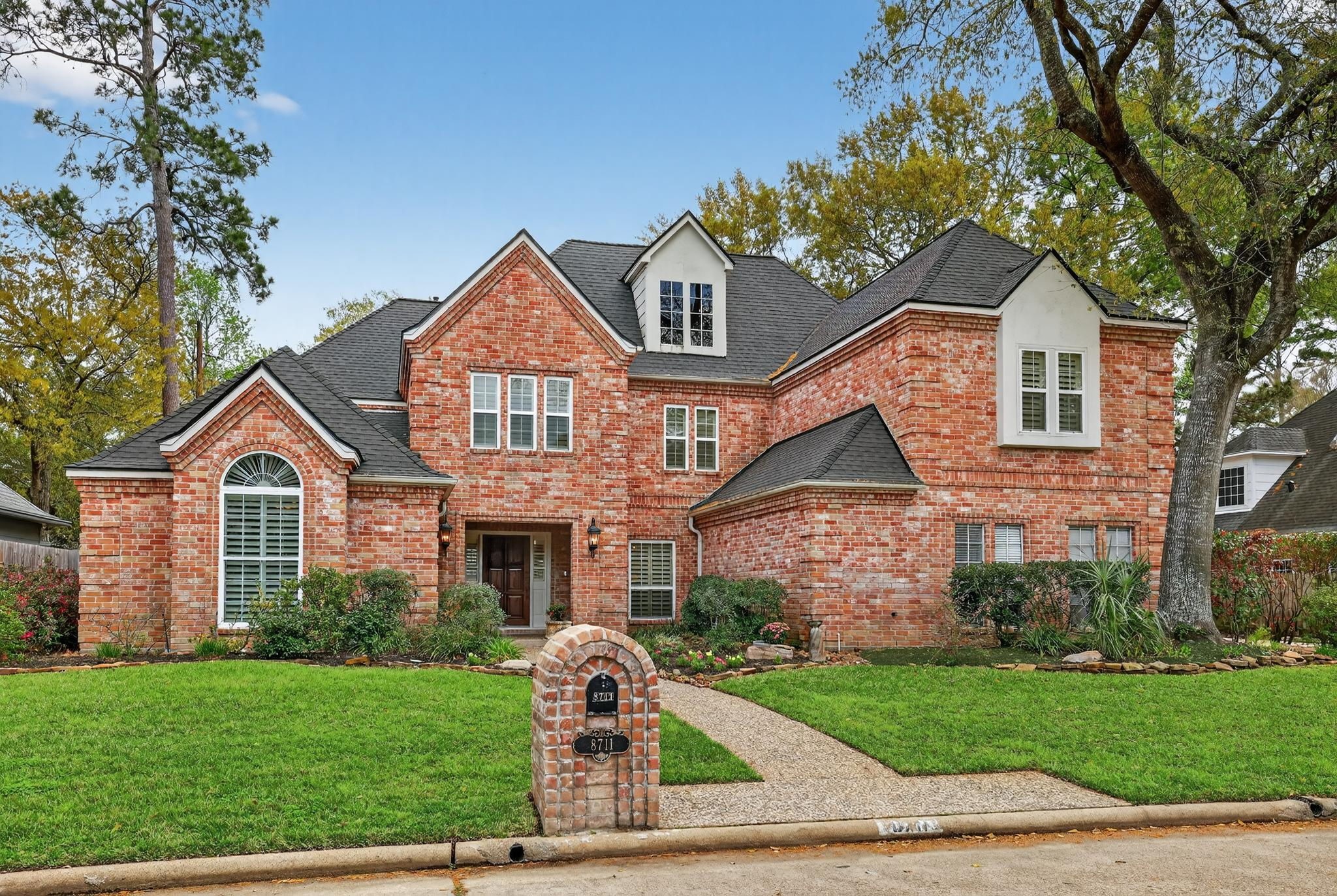 8711 Kennet Valley Road Spring, TX 77379 - Photo 1 of 37 a front view of a house with a yard