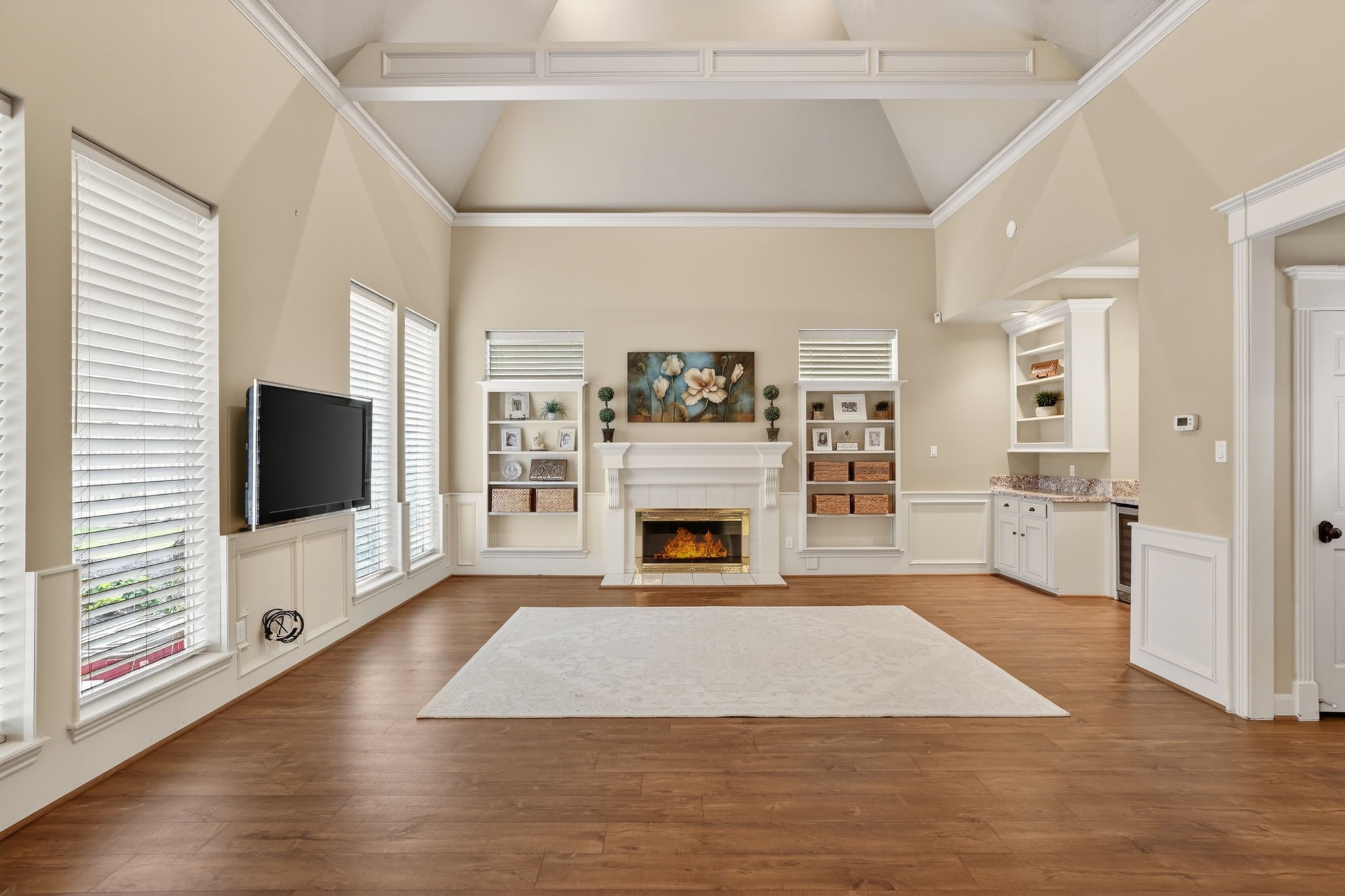 8711 Kennet Valley Road Spring, TX 77379 - Photo 13 of 37 a view of a livingroom with wooden floor and a fireplace