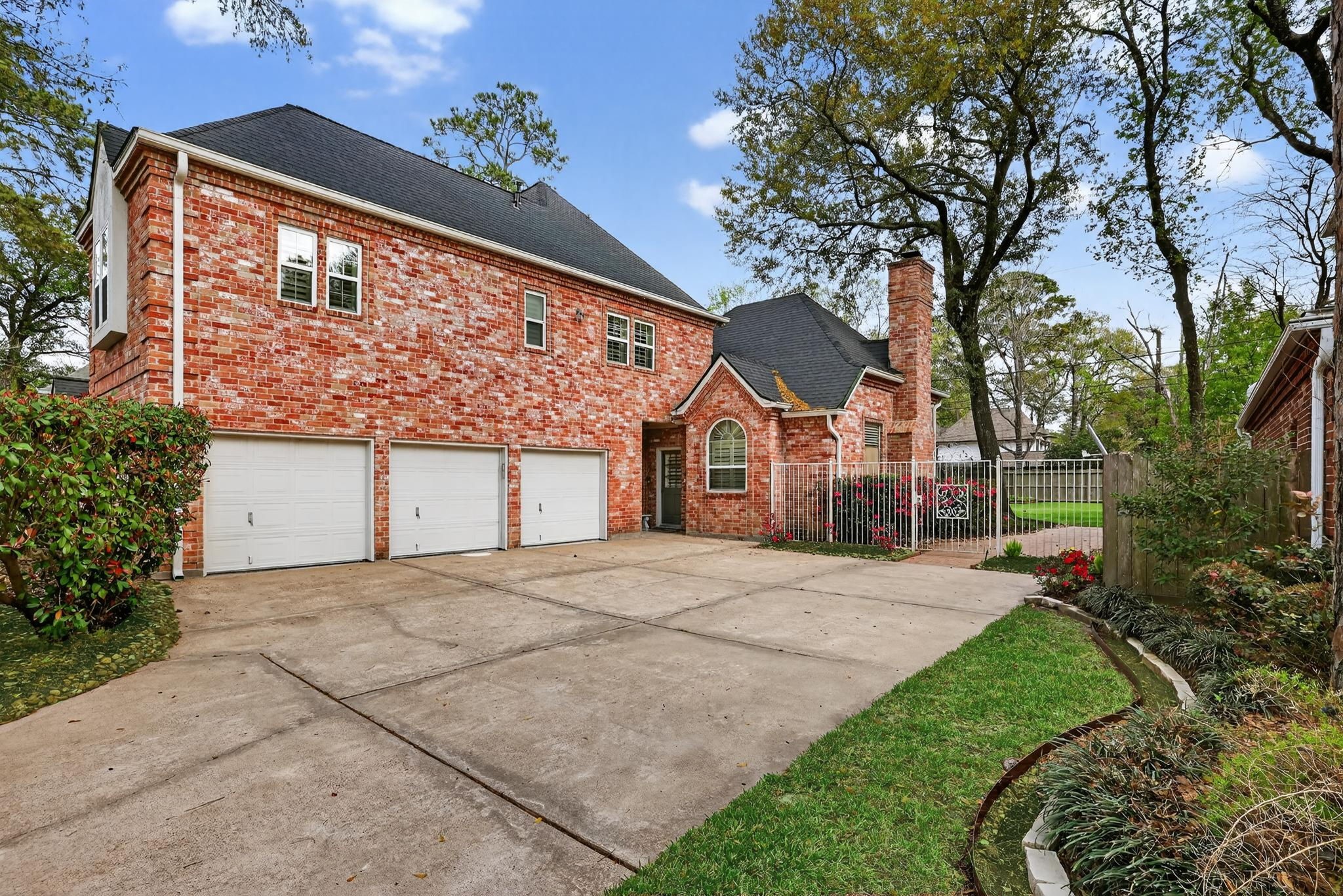8711 Kennet Valley Road Spring, TX 77379 - Photo 2 of 37 a front view of a house with a yard and garage