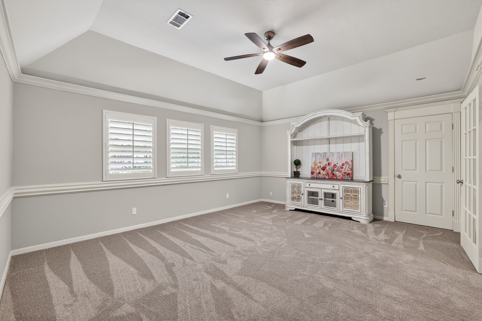 8711 Kennet Valley Road Spring, TX 77379 - Photo 22 of 37 a very nice looking bedroom with a bed and a chandelier