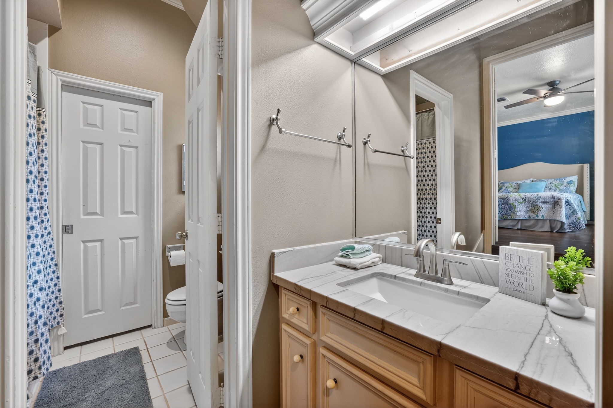 8711 Kennet Valley Road Spring, TX 77379 - Photo 24 of 37 a bathroom with a granite countertop sink a mirror and a shower