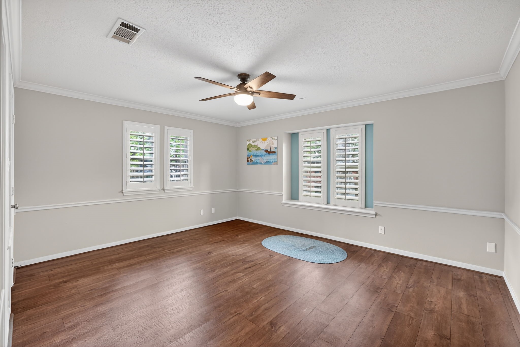 8711 Kennet Valley Road Spring, TX 77379 - Photo 27 of 37 an empty room with wooden floor and windows