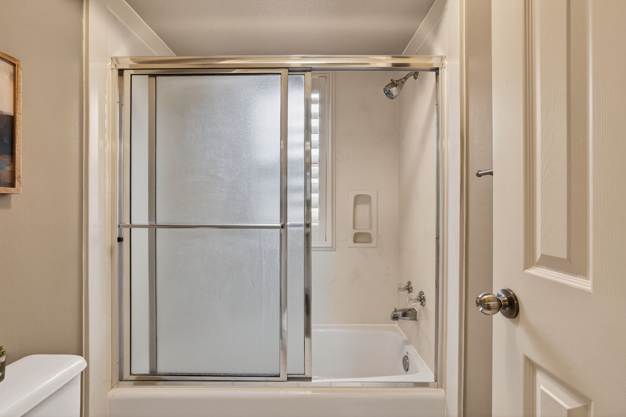8711 Kennet Valley Road Spring, TX 77379 - Photo 28 of 37 a bathroom with a glass shower door