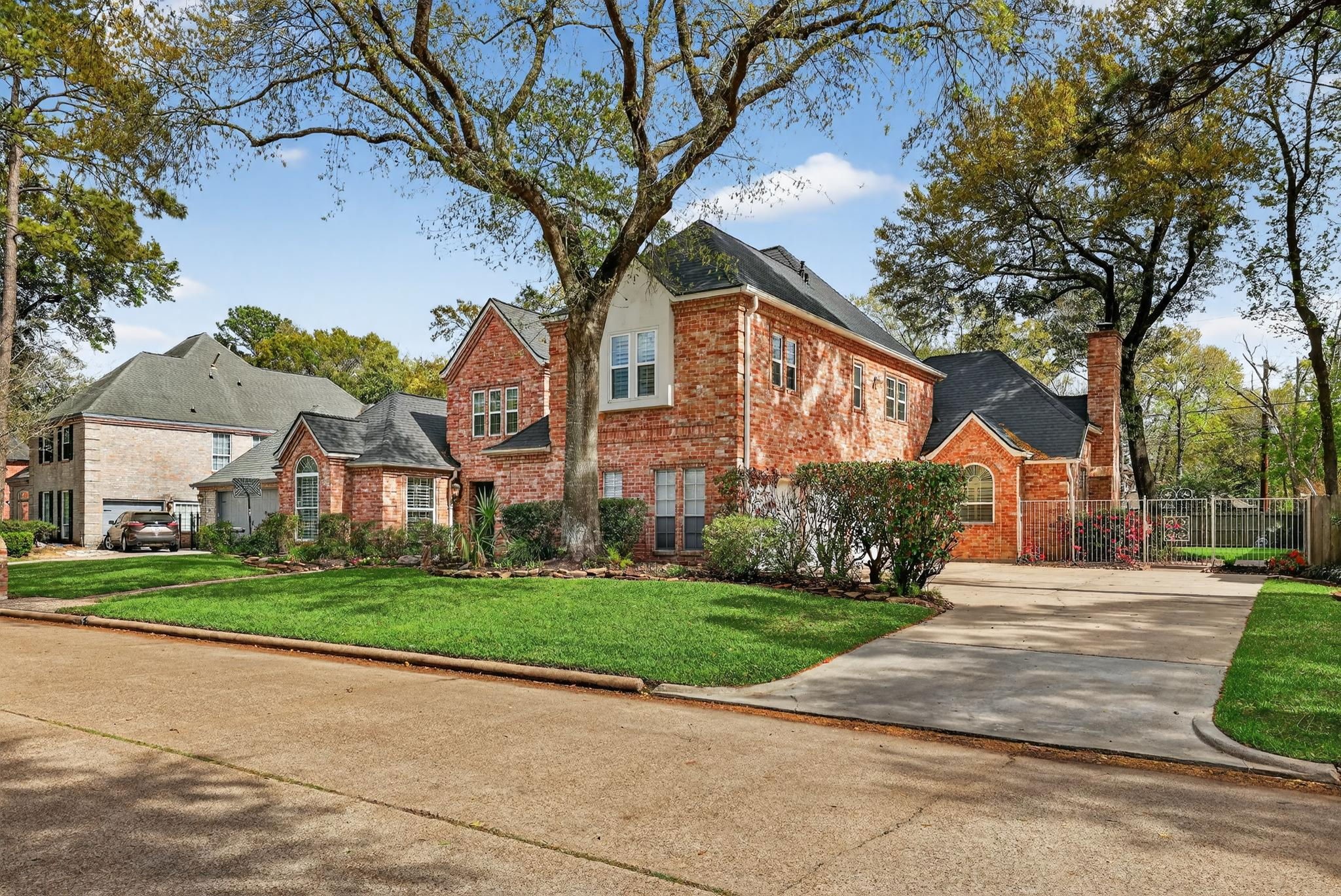 8711 Kennet Valley Road Spring, TX 77379 - Photo 34 of 37 a view of a big house with a big yard and large trees