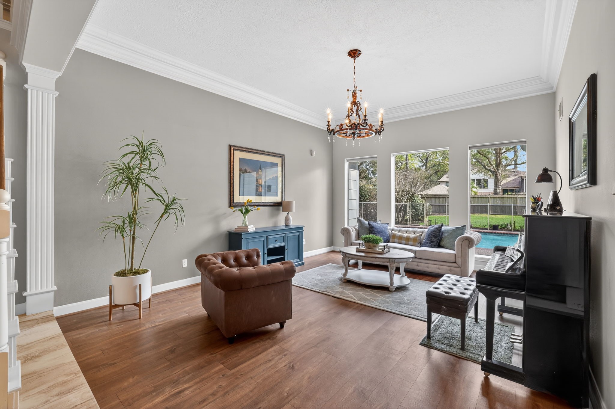 8711 Kennet Valley Road Spring, TX 77379 - Photo 5 of 37 a living room with furniture and a chandelier
