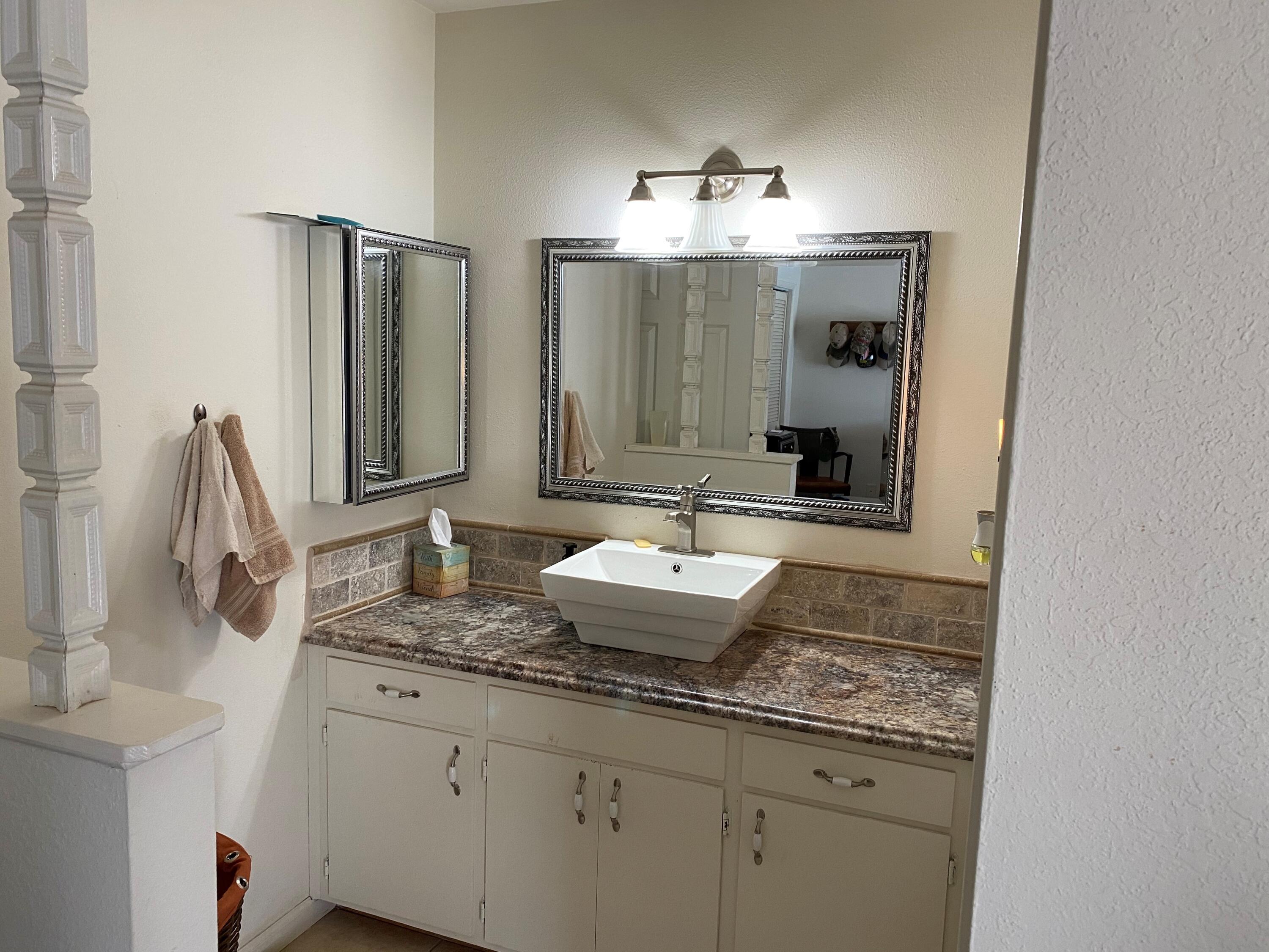 351 South Cornucopia Road Exeter, CA 93221 - Photo 12 of 22 a bathroom with double vanity and a mirror