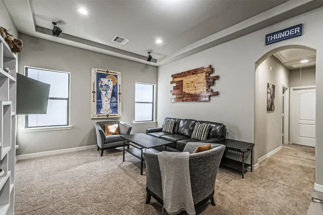 a living room with furniture and window