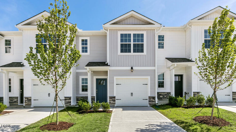 300 Perseus Street Angier, NC 27501 - Photo 1 of 26 a front view of a house with a yard