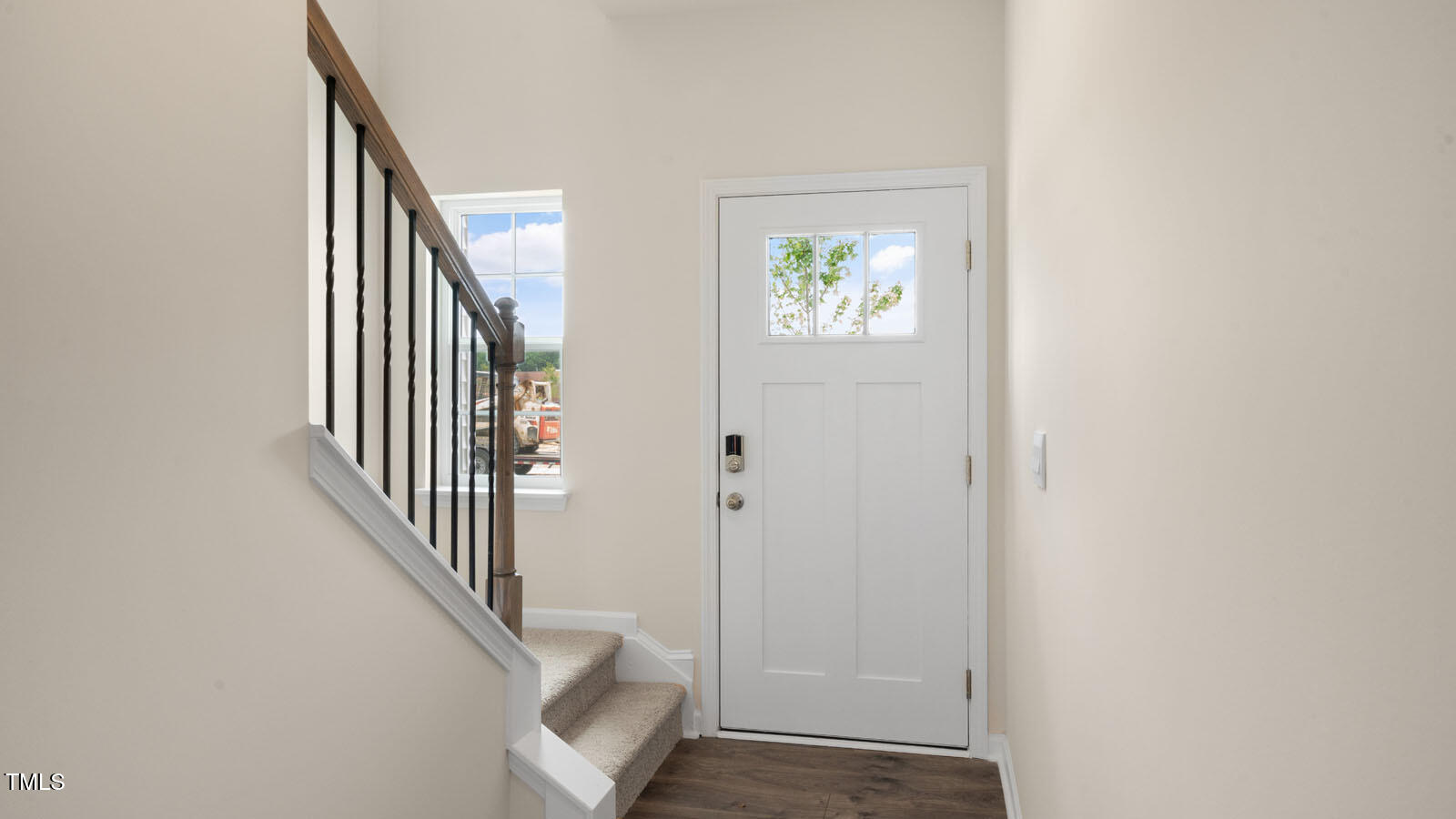 300 Perseus Street Angier, NC 27501 - Photo 2 of 26 an entryway with a white walls and stairs