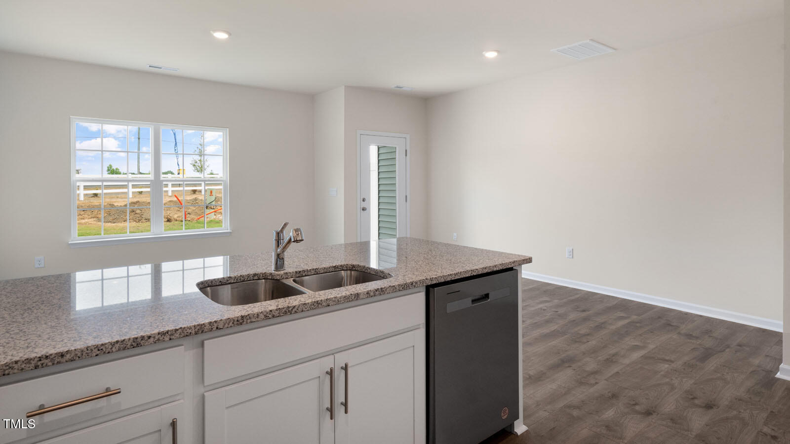 300 Perseus Street Angier, NC 27501 - Photo 9 of 26 a kitchen with a sink cabinets and window