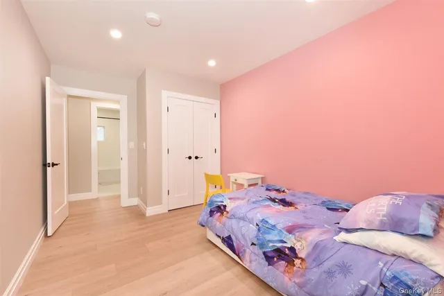 a bedroom with a bed and hallway