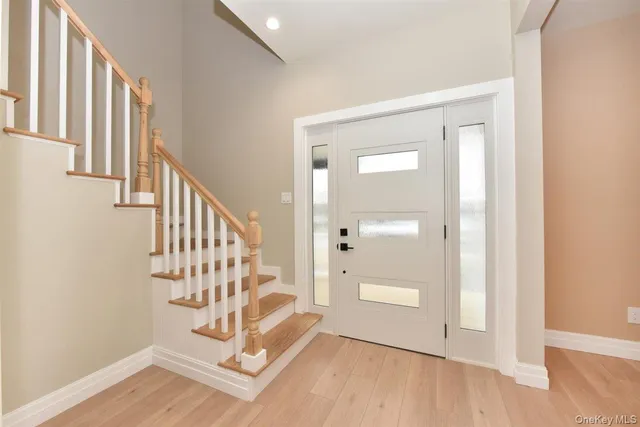 a view of entryway with wooden floor