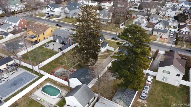 an aerial view of residential house with outdoor space and parking