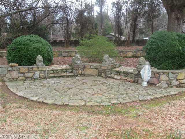 506 Barnes Road Winston-Salem, NC 27107 - Photo 14 of 14 Yard/Garden. Here is the patio with the attractive stone work that is featured throughout the exterior landscape.