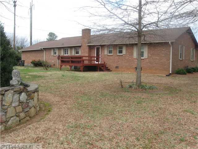 506 Barnes Road Winston-Salem, NC 27107 - Photo 5 of 14 Yard/Garden. View of the back of the house. Note raised beds with stone walls.