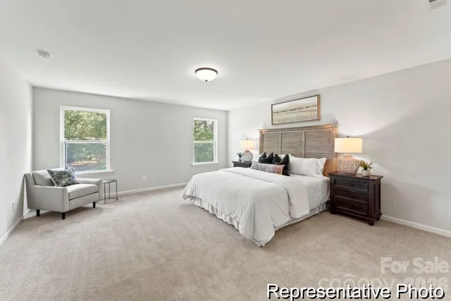 a bedroom with bed and window