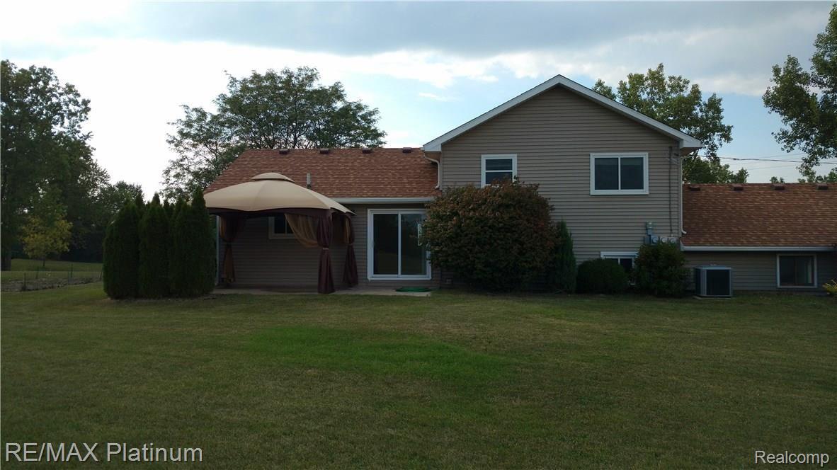 555 West Marr Road Howell, MI 48855 - Photo 3 of 19 GAZEBO INCLUDED ( PATIO HAS FOOTINGS, IF YOU WANT TO BUILD A SUN ROOM).