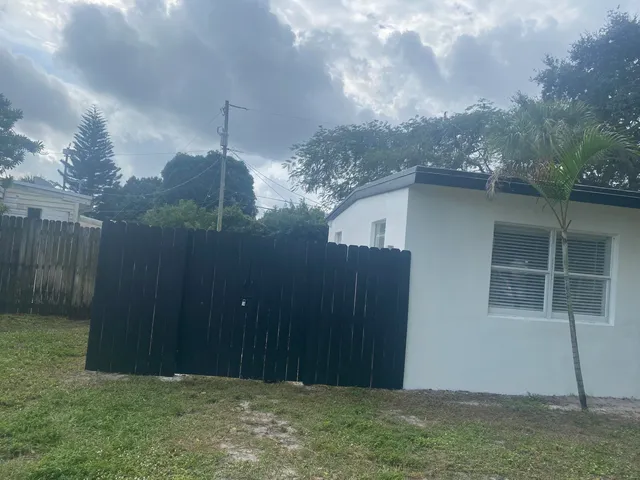 a backyard of a house with lots of green space