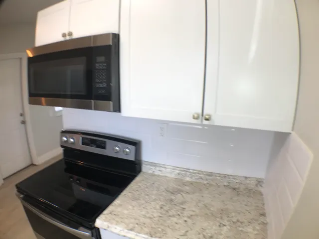 a kitchen with stainless steel appliances a refrigerator and a sink