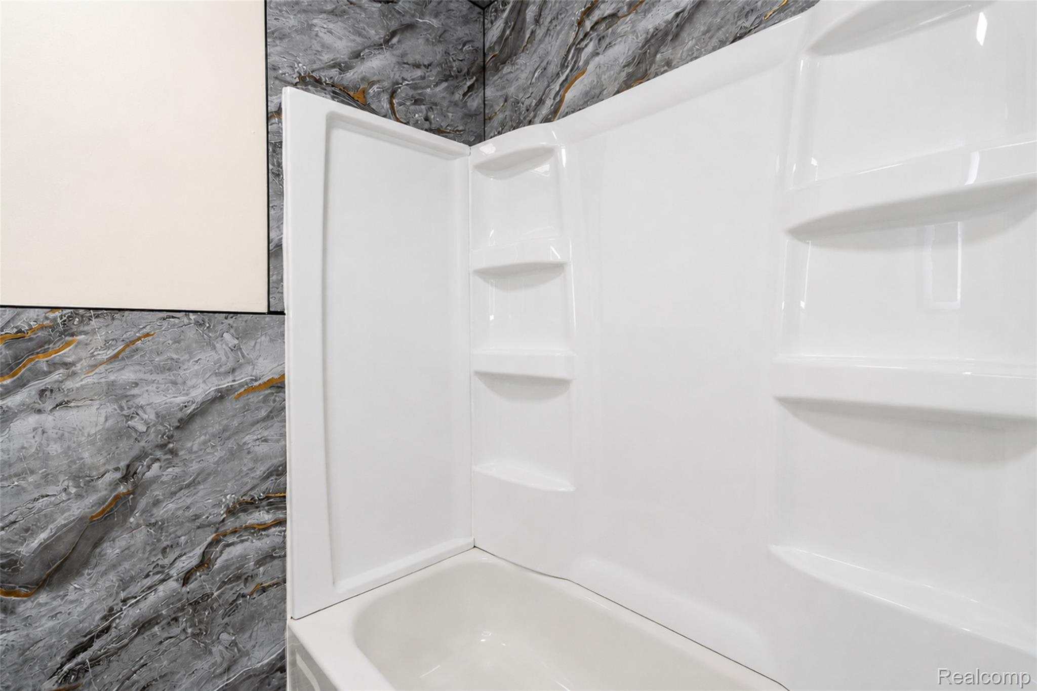 201 Cardwell Street Inkster, MI 48141 - Photo 19 of 41 White bathtub and shower surround with integrated shelving