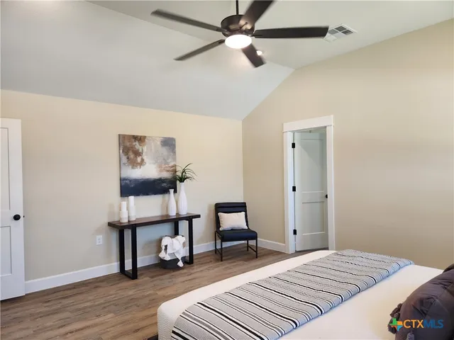 a bedroom with a bed and a dresser