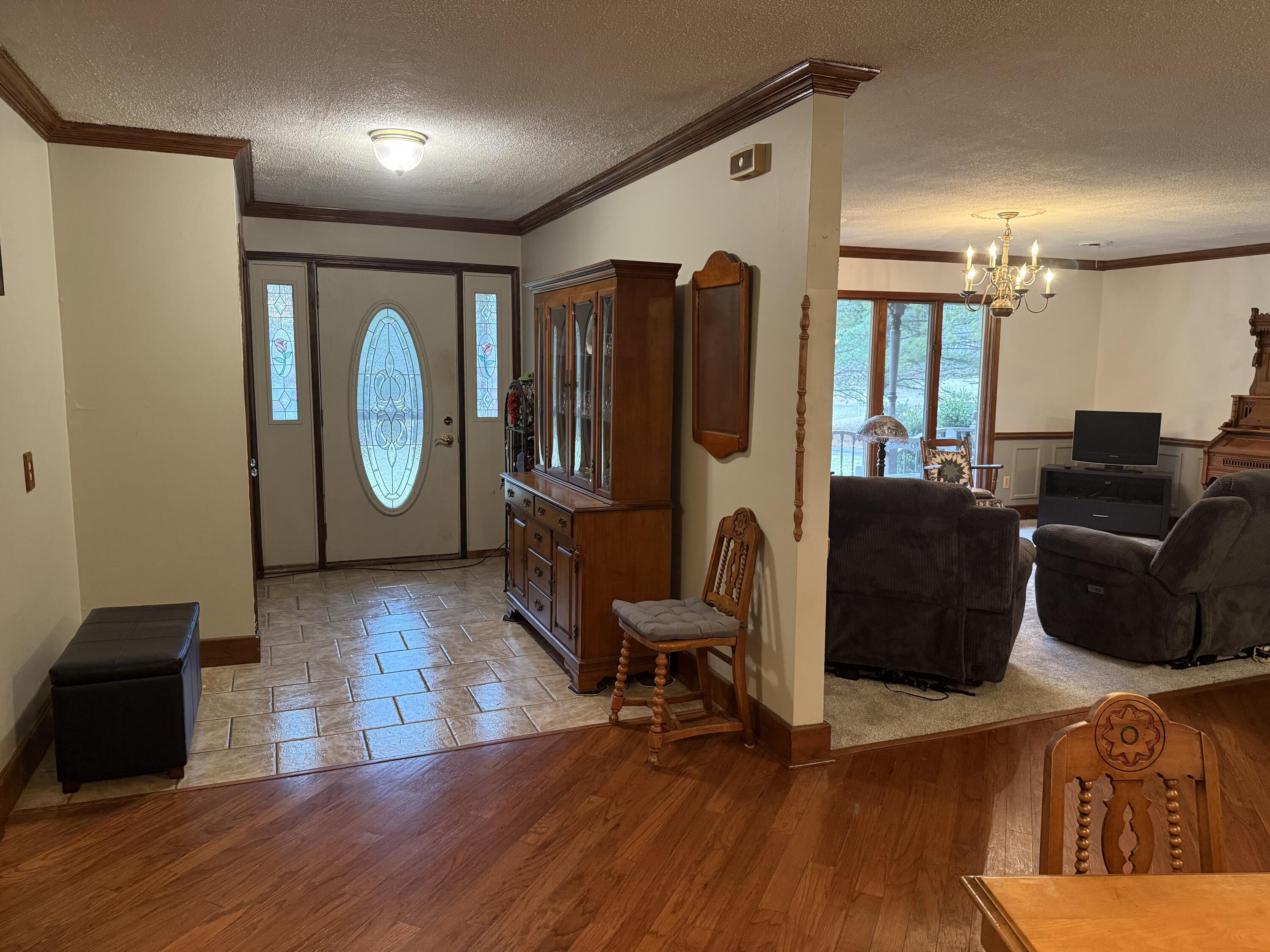 368 South 600th Street West Hebron, IN 46341 - Photo 20 of 87 a living room with furniture a flat screen tv and wooden floor