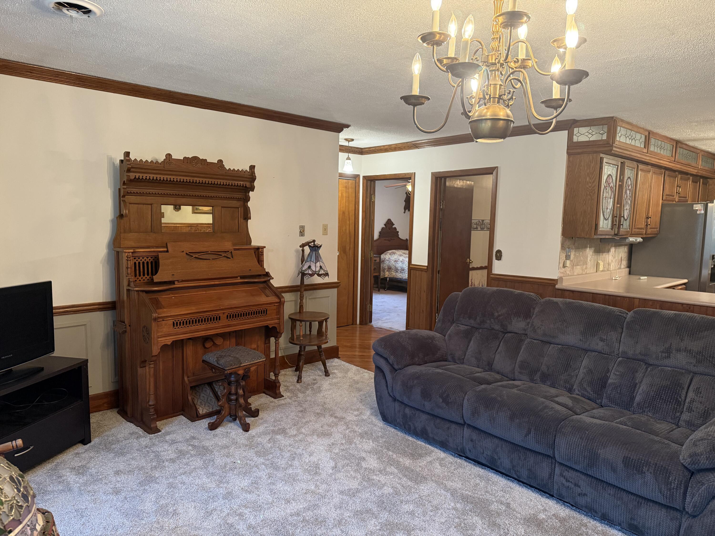 368 South 600th Street West Hebron, IN 46341 - Photo 25 of 87 a living room with furniture and a piano