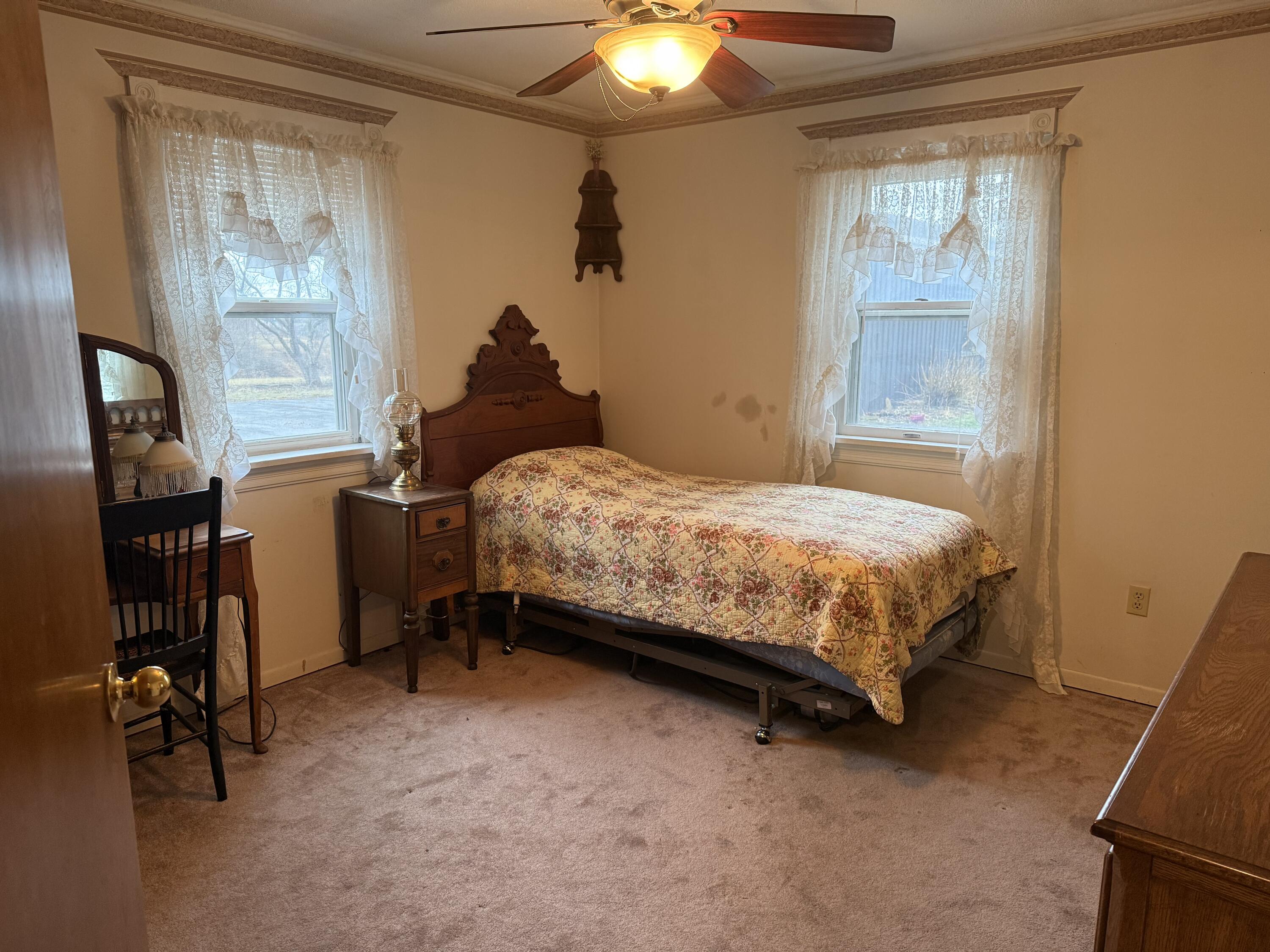 368 South 600th Street West Hebron, IN 46341 - Photo 31 of 87 a bedroom with a bed and a chandelier