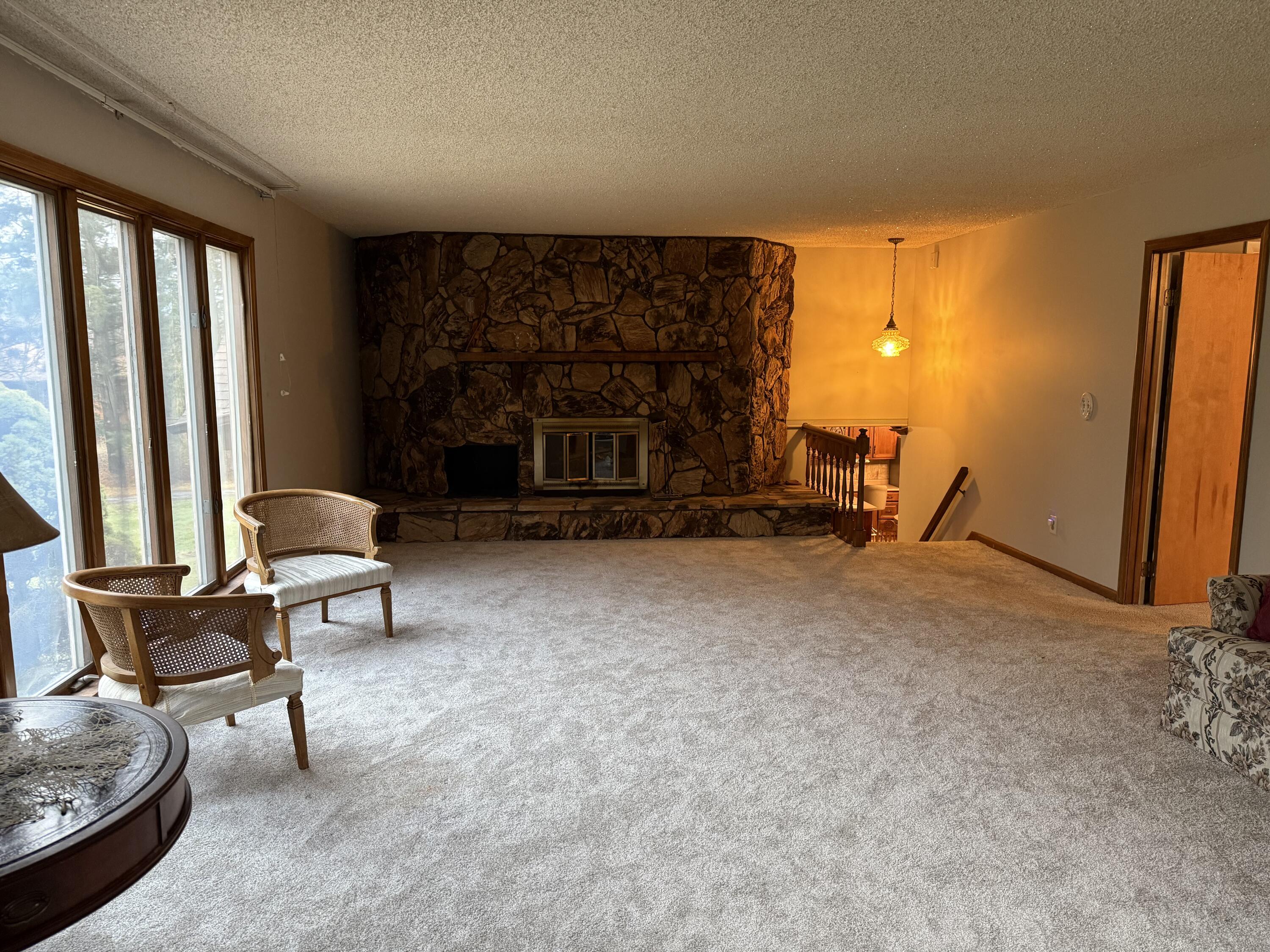 368 South 600th Street West Hebron, IN 46341 - Photo 36 of 87 a living room with furniture and a fireplace