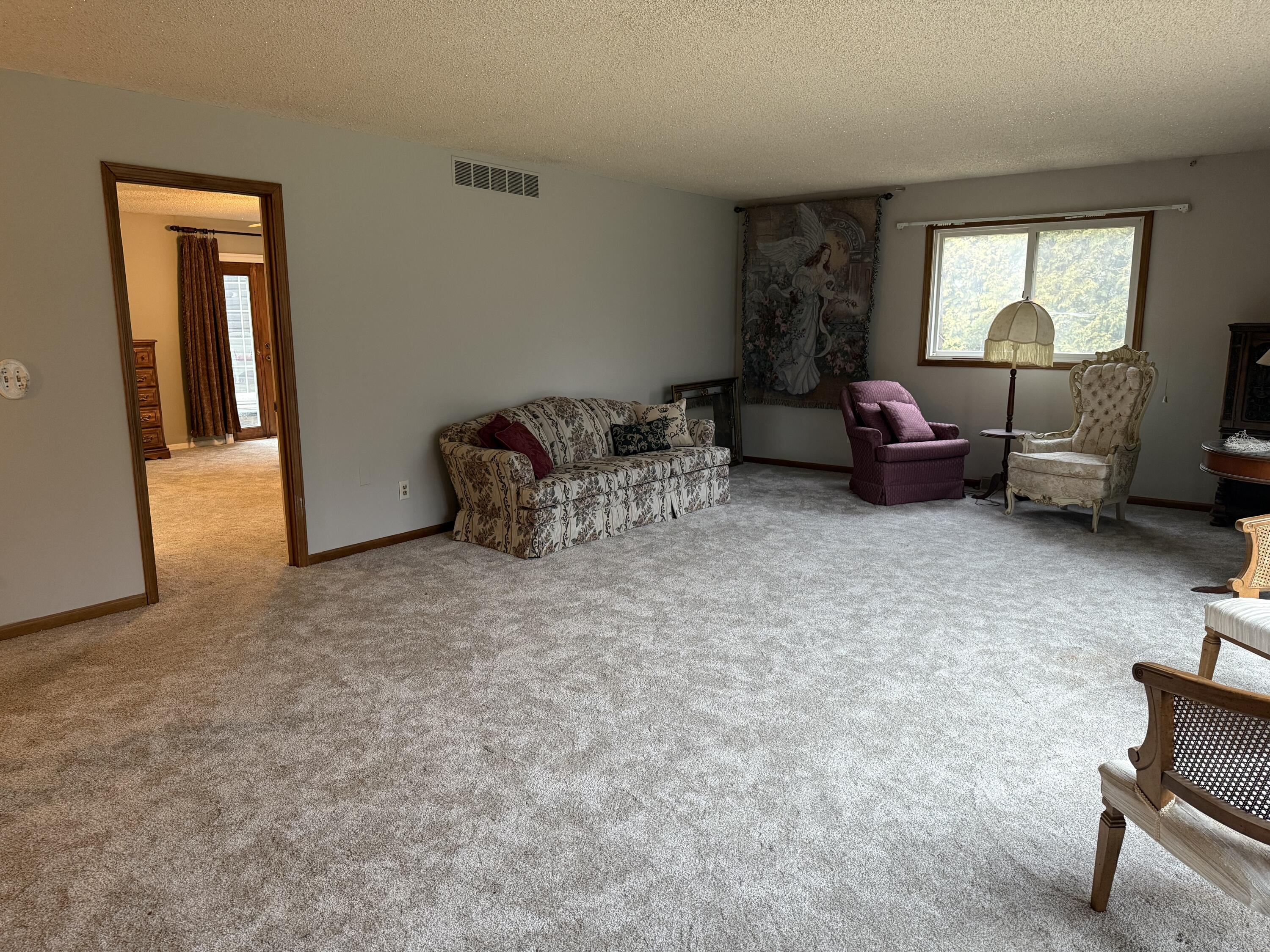 368 South 600th Street West Hebron, IN 46341 - Photo 38 of 87 a living room with furniture and a mirror