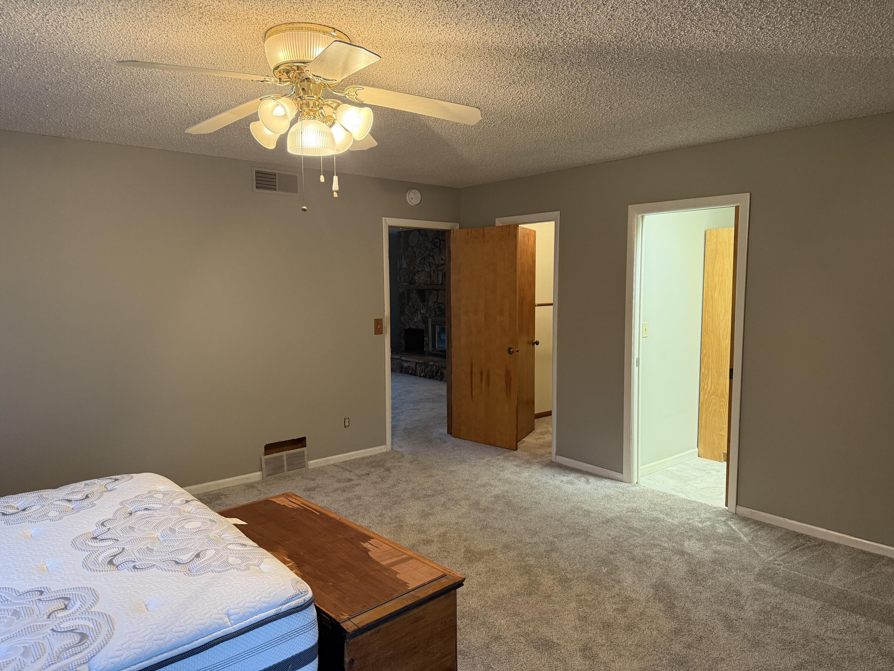 368 South 600th Street West Hebron, IN 46341 - Photo 40 of 87 a bedroom with a bed and a chandelier